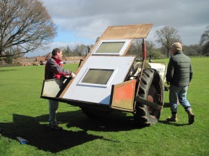 Leo & Mally transport the old scoreboard fascia to the bonfire